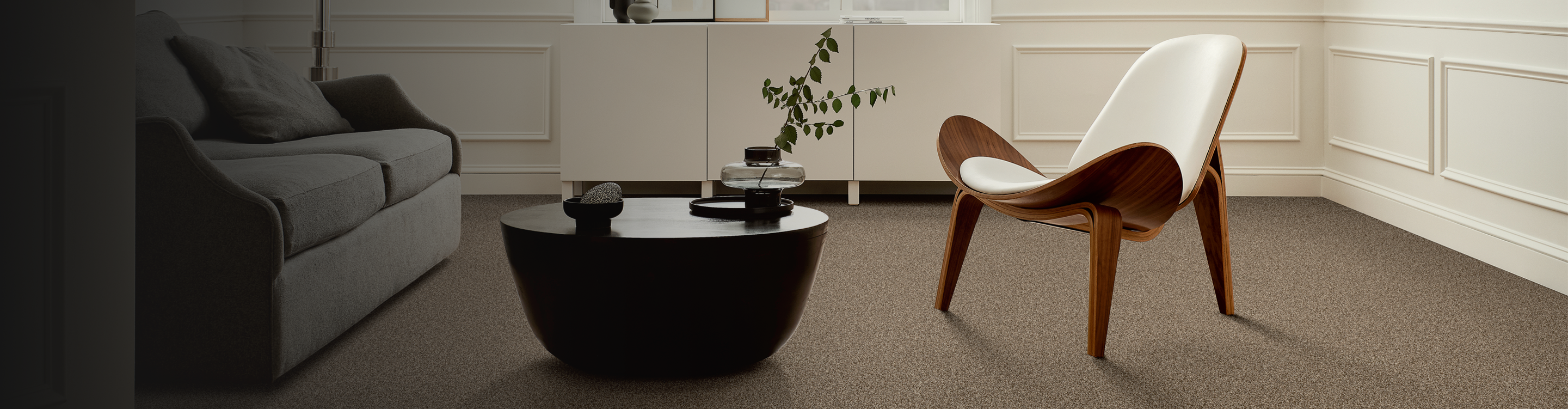 Living room with accent chair and brown carpet